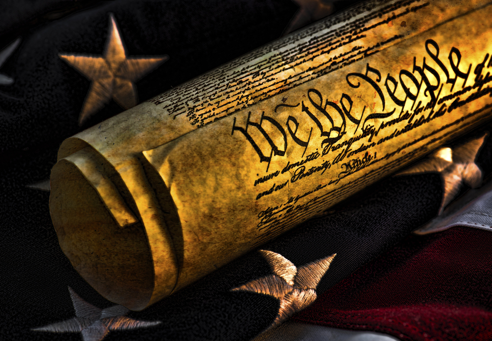 US Constitution on folded flag